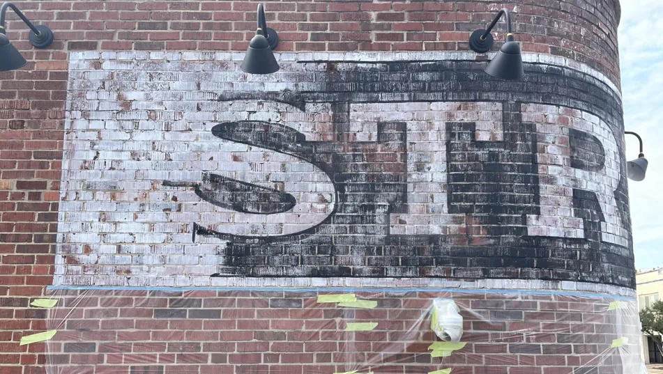 ghost sign - cutting in the lettering - Florence Alabama 